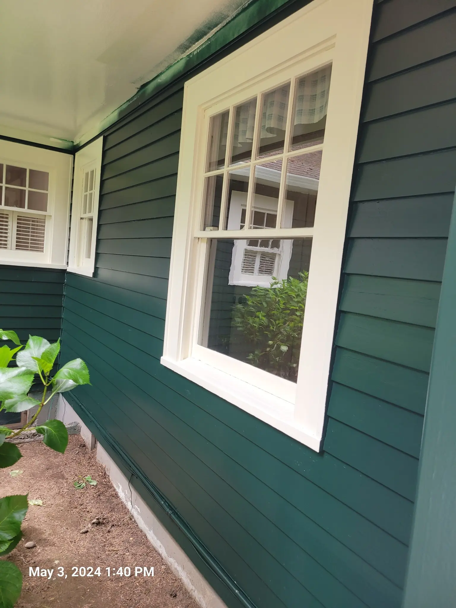 Expert house painters in Vancouver WA preparing exterior surfaces